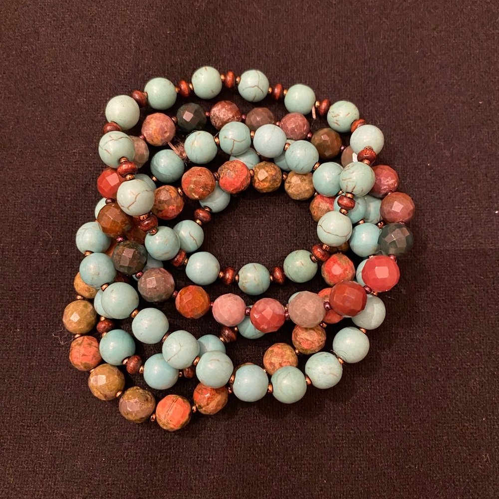 SET OF FIVE BEADED BRACELETS